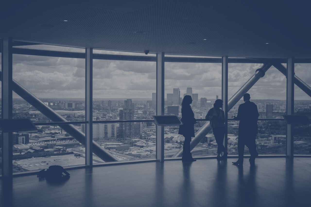 People in conversation overlooking a city